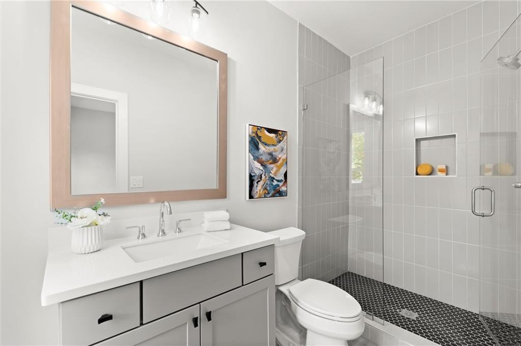 3794 Wynn Walk Brookhaven, GA 30341 - Photo 28 of 50 a bathroom with a sink a toilet and shower