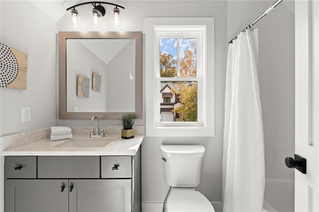 3794 Wynn Walk Brookhaven, GA 30341 - Photo 32 of 50 a bathroom with a sink mirror and toilet