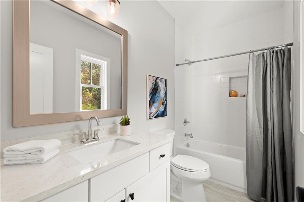 3794 Wynn Walk Brookhaven, GA 30341 - Photo 35 of 50 a bathroom with a granite countertop sink toilet and shower