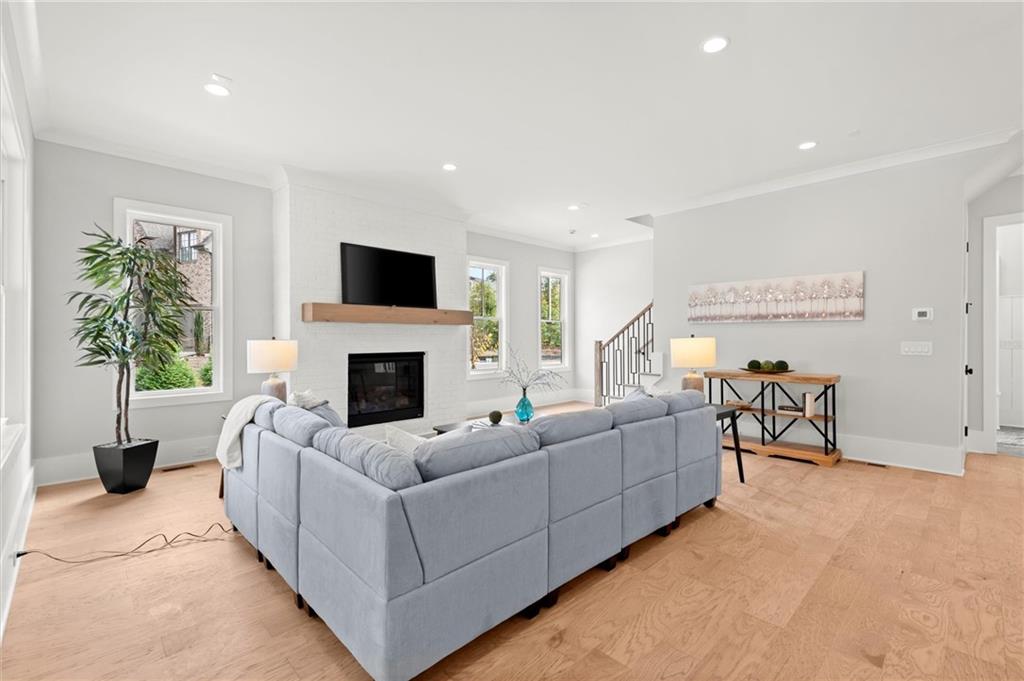 3794 Wynn Walk Brookhaven, GA 30341 - Photo 48 of 50 a living room with furniture a fireplace and a flat screen tv