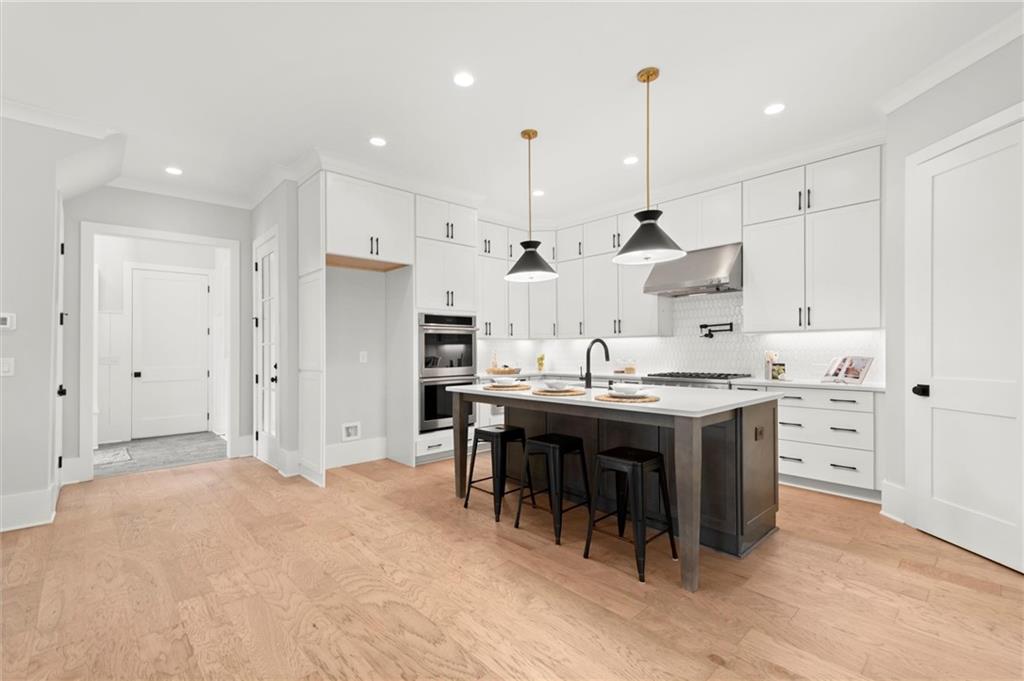 3794 Wynn Walk Brookhaven, GA 30341 - Photo 7 of 50 a large kitchen with stainless steel appliances kitchen island granite countertop a sink and a refrigerator