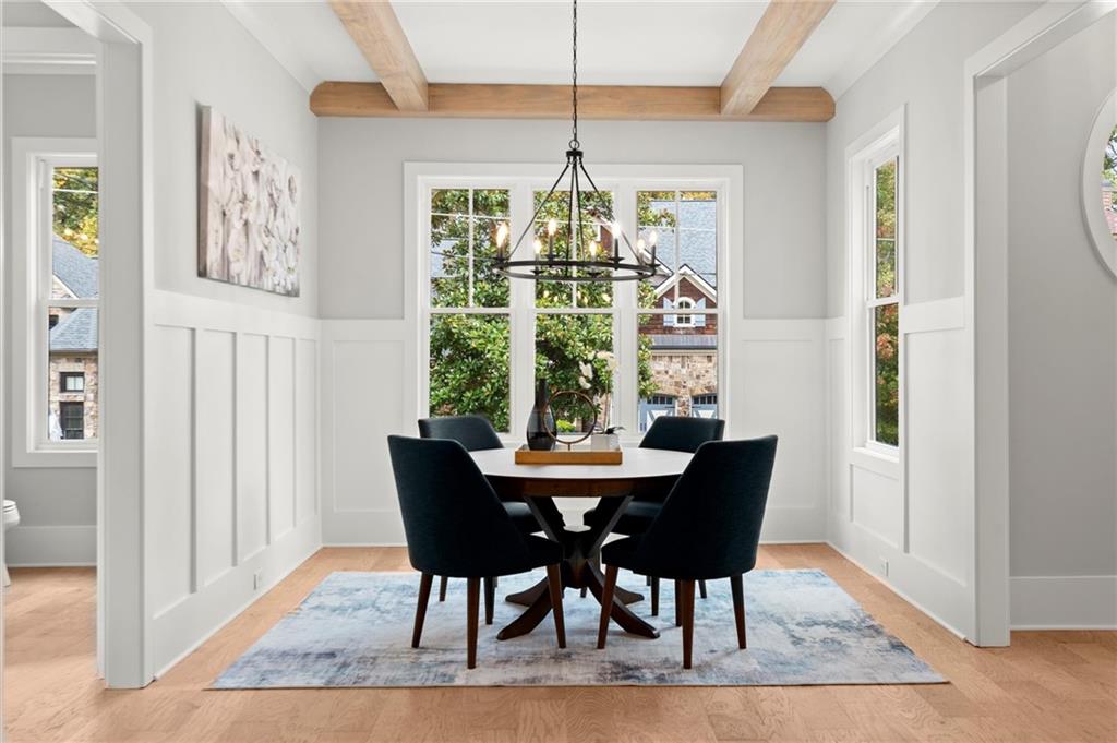 3794 Wynn Walk Brookhaven, GA 30341 - Photo 10 of 50 a dining room with furniture a rug and a chandelier