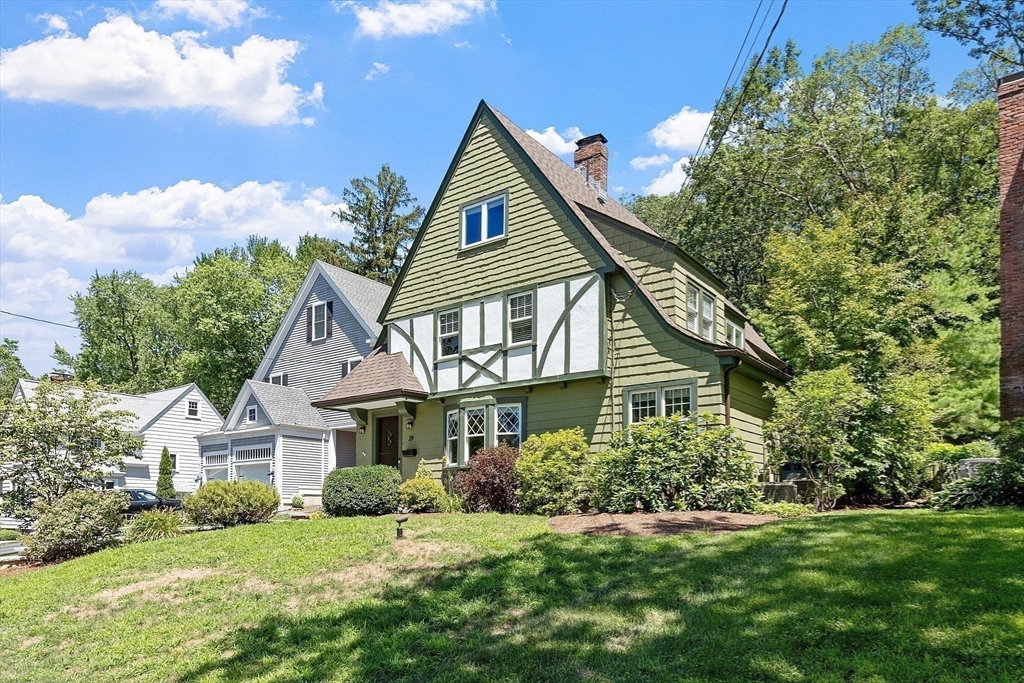 29 Downing Road Lexington, MA 02421 - Photo 1 of 38 a front view of a house with a yard
