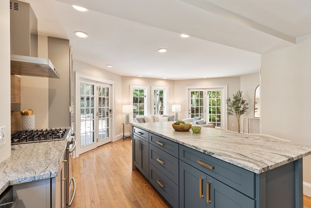 29 Downing Road Lexington, MA 02421 - Photo 11 of 38 a hall with kitchen island granite countertop a large window