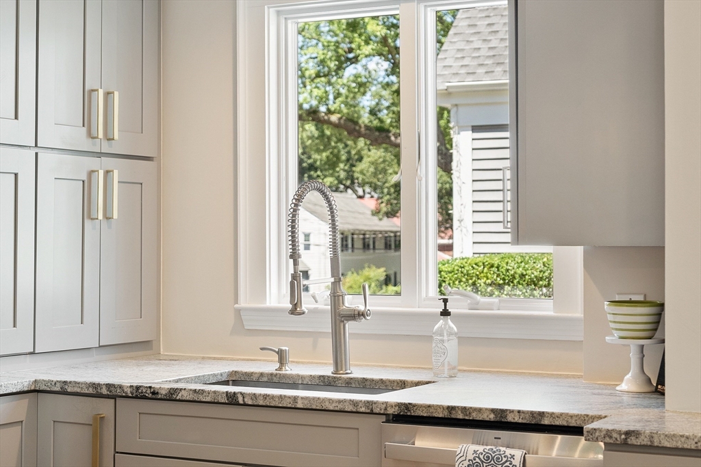 29 Downing Road Lexington, MA 02421 - Photo 16 of 38 a kitchen with granite countertop a window and a sink