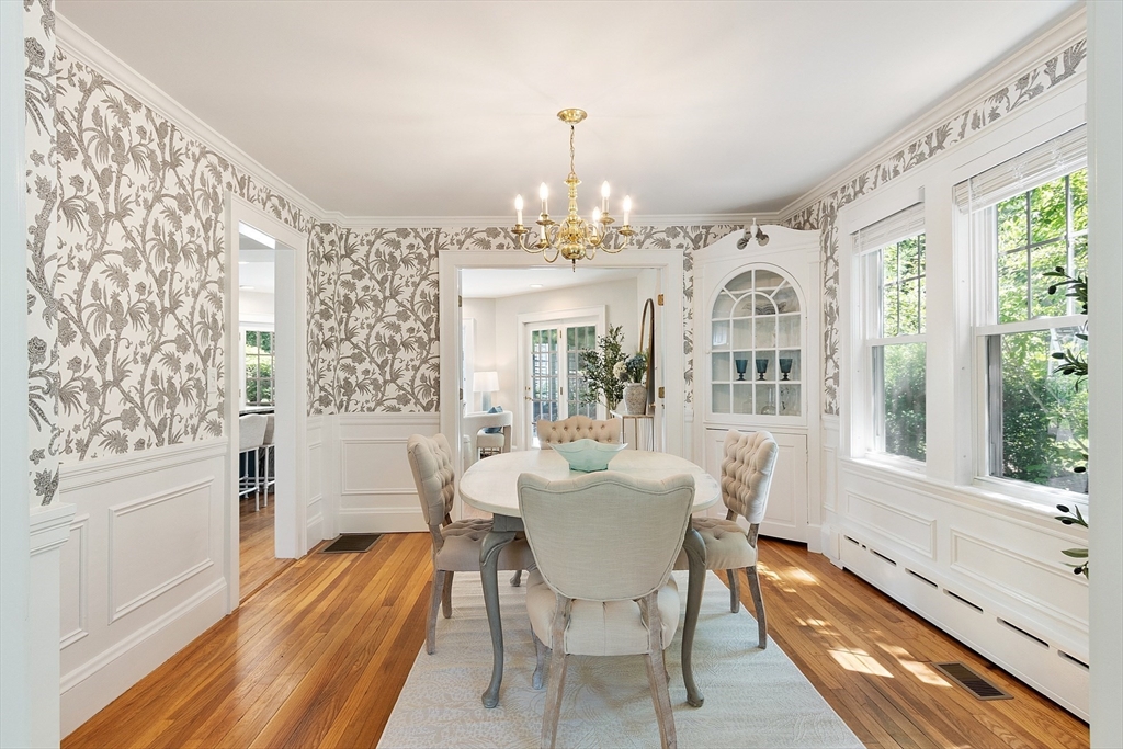 29 Downing Road Lexington, MA 02421 - Photo 20 of 38 a view of a dining room with furniture a chandelier and wooden floor