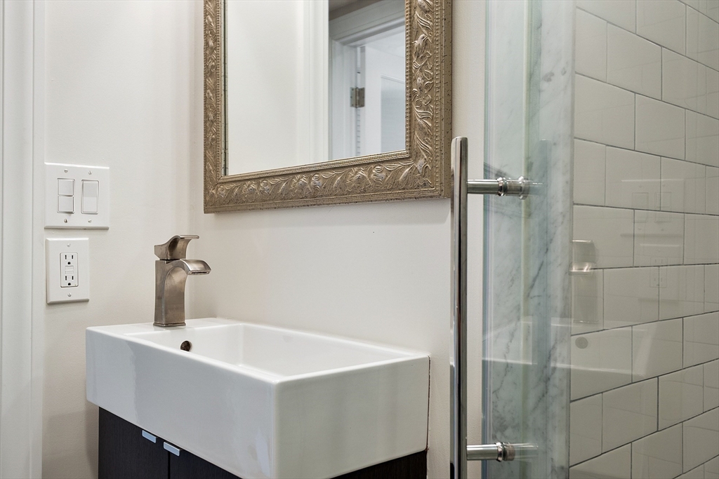 29 Downing Road Lexington, MA 02421 - Photo 23 of 38 a bathroom with a sink and a mirror
