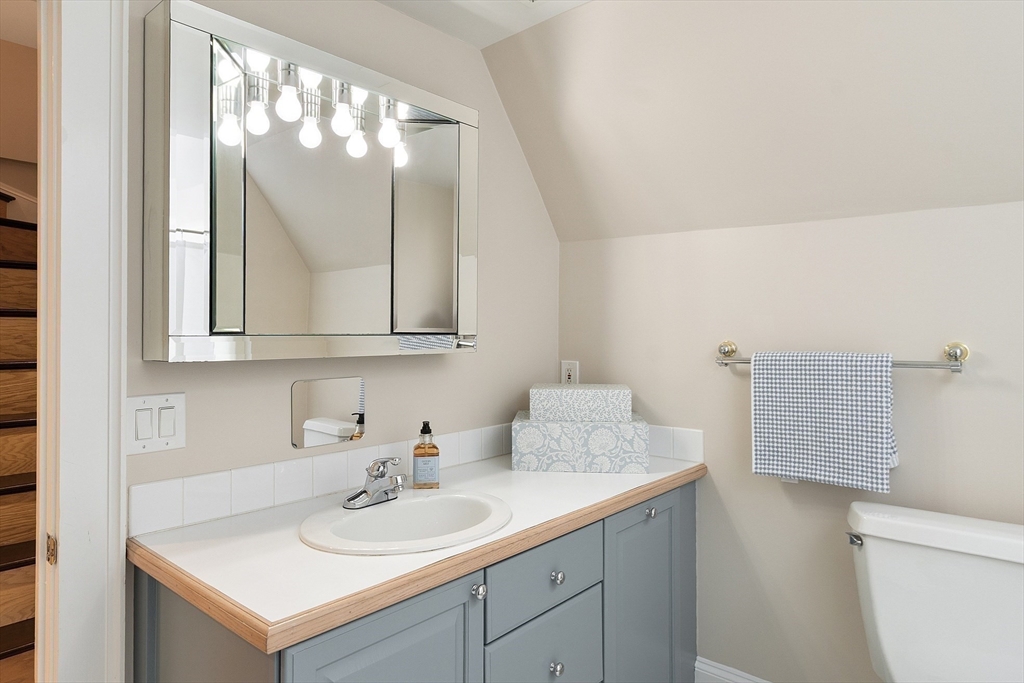 29 Downing Road Lexington, MA 02421 - Photo 25 of 38 a bathroom with a sink and a mirror