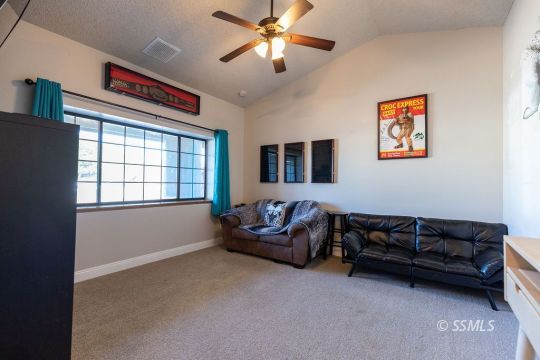 809 Valarie Street Ridgecrest, CA 93555 - Photo 8 of 8 a living room with furniture and a window
