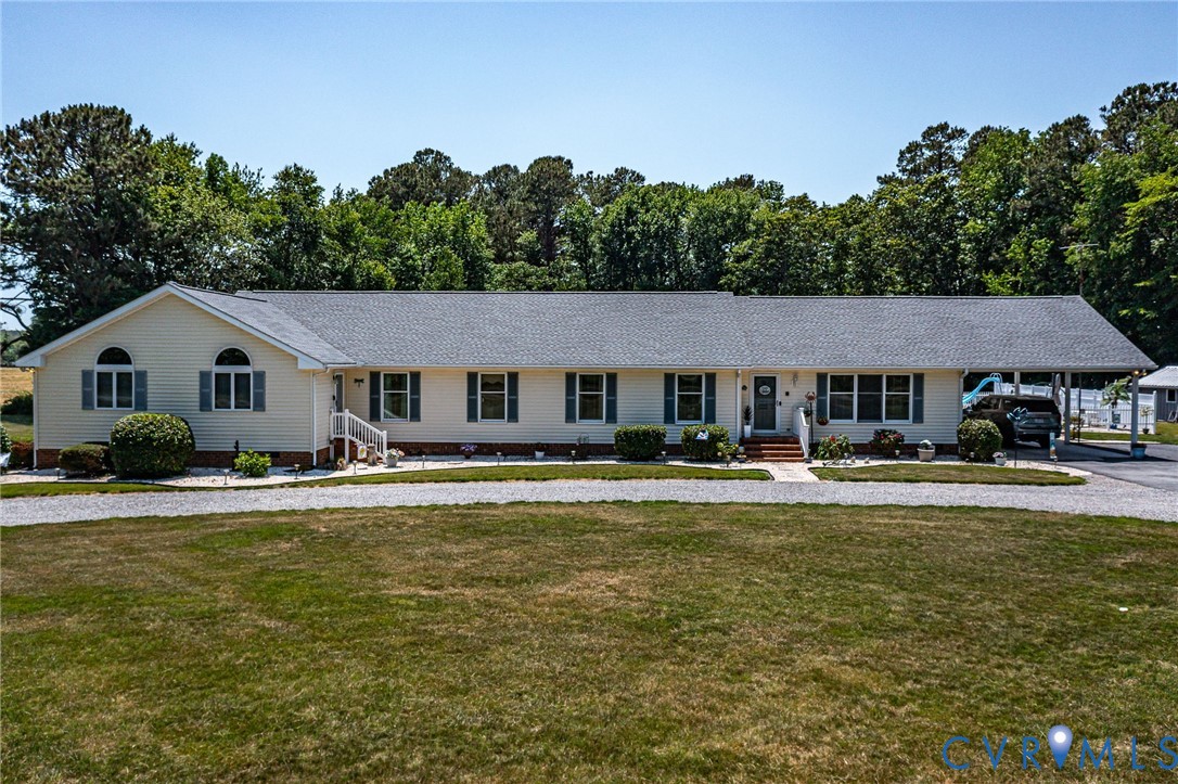 4400 Hacks Neck Road Heathsville, VA 22473 - Photo 54 of 78 a front view of a house with a yard