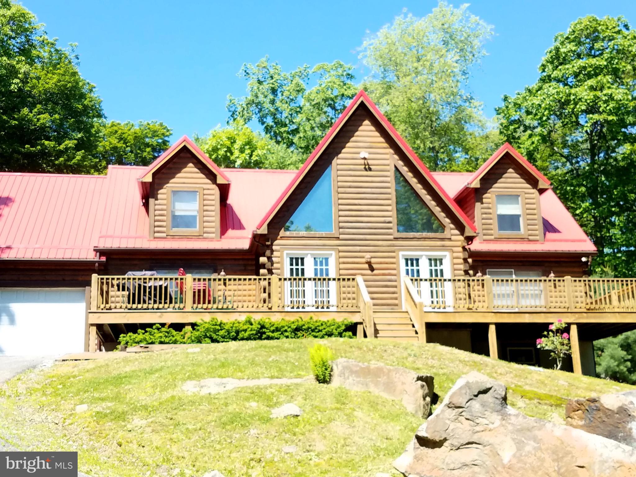 412 Tanglewood Road Oakland, MD 21550 - Photo 1 of 41 a view of a house with a swimming pool