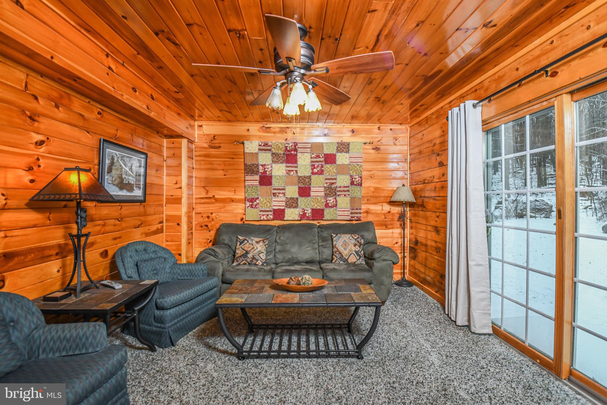 412 Tanglewood Road Oakland, MD 21550 - Photo 22 of 41 a outdoor living space with patio furniture and a ceiling fan