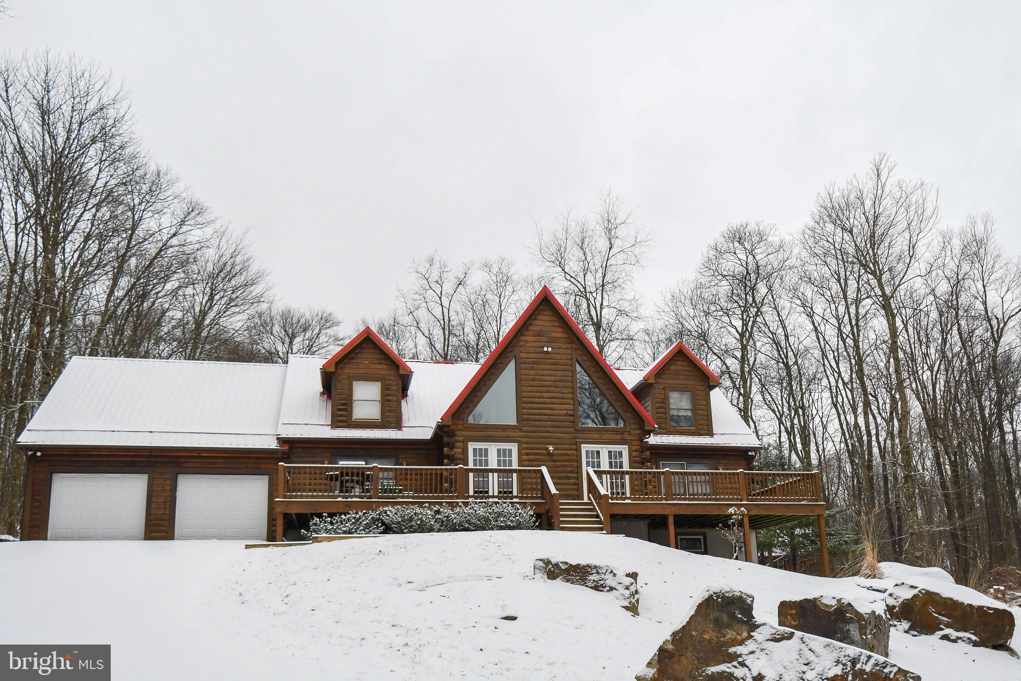 412 Tanglewood Road Oakland, MD 21550 - Photo 23 of 41 a front view of a house with a yard