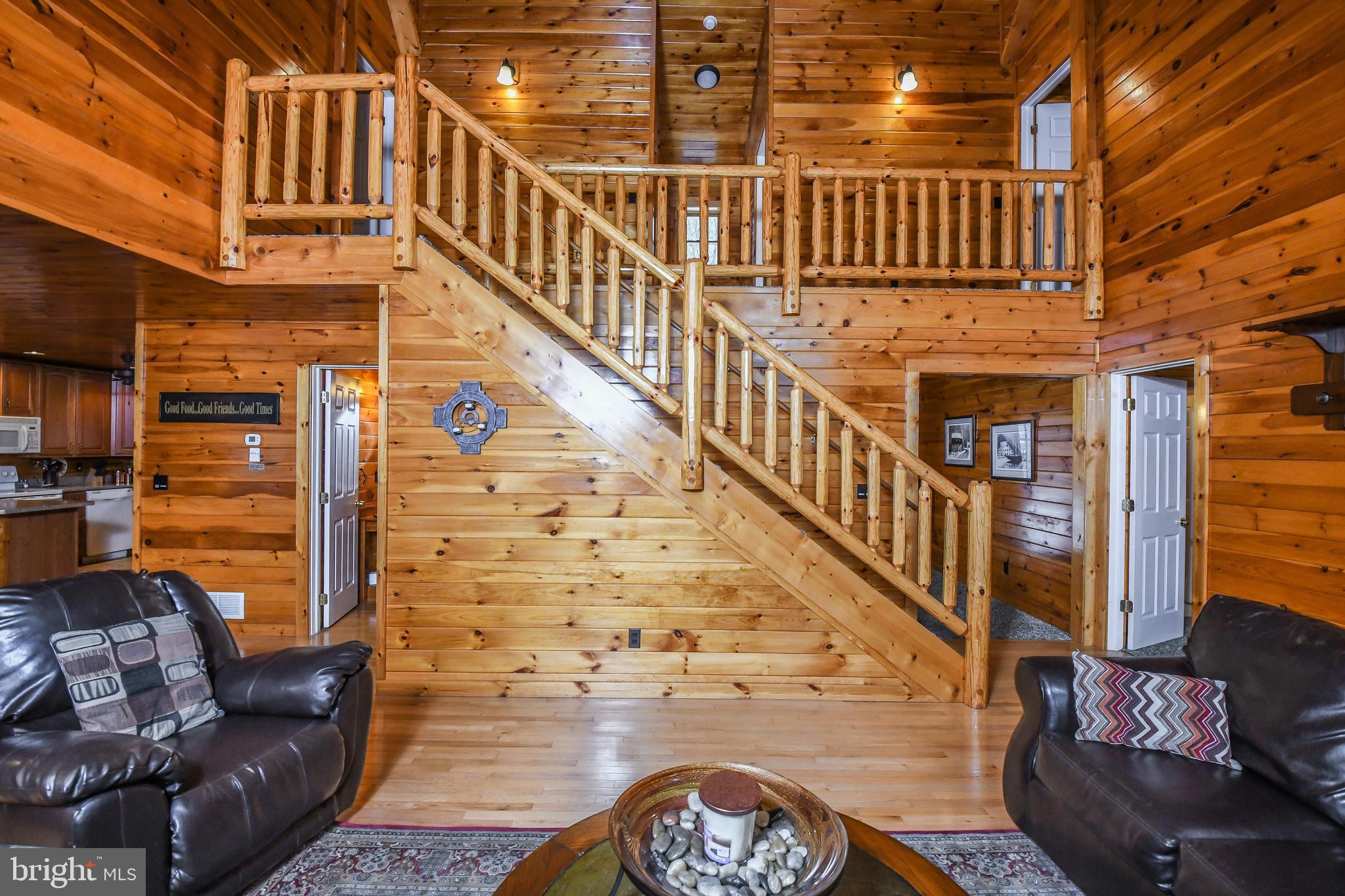 412 Tanglewood Road Oakland, MD 21550 - Photo 4 of 41 a view of staircase with wooden floor and windows