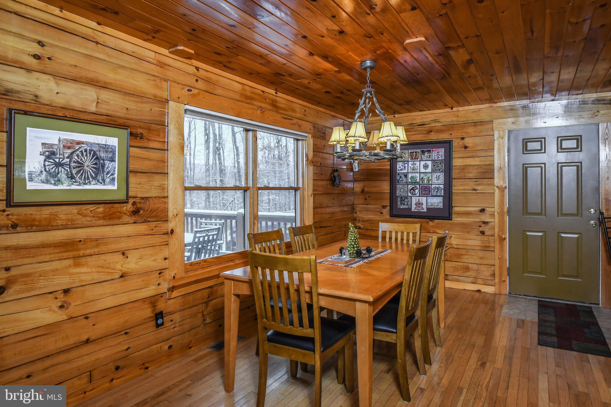 412 Tanglewood Road Oakland, MD 21550 - Photo 10 of 41 a view of a dining room with furniture window and outside view