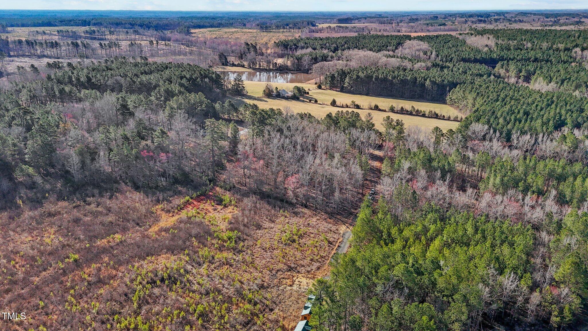 1665 Satterwhite Road Oxford, NC 27565 - Photo 30 of 41 an aerial view of residential houses with outdoor space and trees