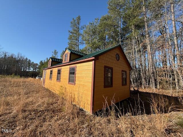1665 Satterwhite Road Oxford, NC 27565 - Photo 39 of 41 a backyard of a house with lots of green space