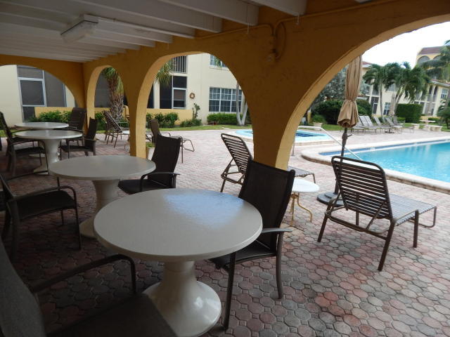 250 Northeast 20th Street, Unit 2250 Boca Raton, FL 33431 - Photo 3 of 15 Tierra del Sol patio by club house
