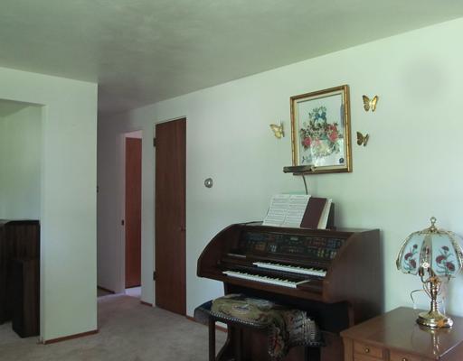 422 Slaughter Hollow Road Irwin, PA 15642 - Photo 8 of 17 Living Room. Another view of living room showing den area opening.