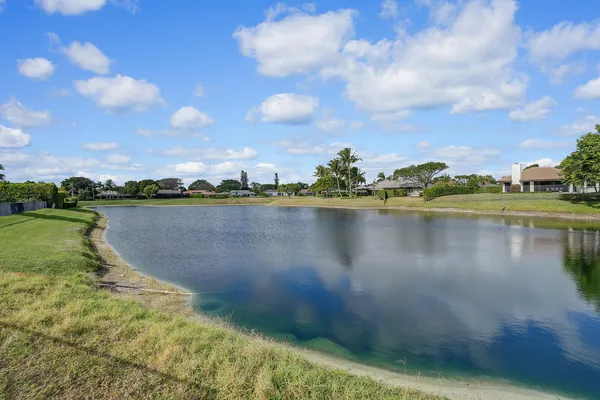 a view of a swimming pool with a yard