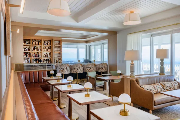an ocean beach with an outdoor seating