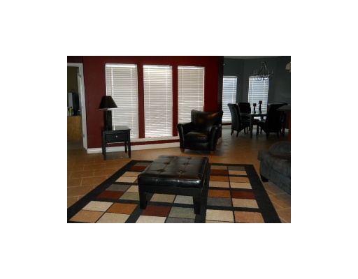 6818 Anvil Drive Corpus Christi, TX 78414 - Photo 2 of 6 a living room with furniture and a floor to ceiling window