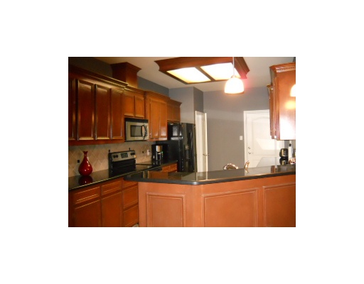 6818 Anvil Drive Corpus Christi, TX 78414 - Photo 4 of 6 a kitchen with a sink and cabinets