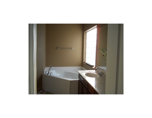 6818 Anvil Drive Corpus Christi, TX 78414 - Photo 6 of 6 a bathroom with a sink and a mirror