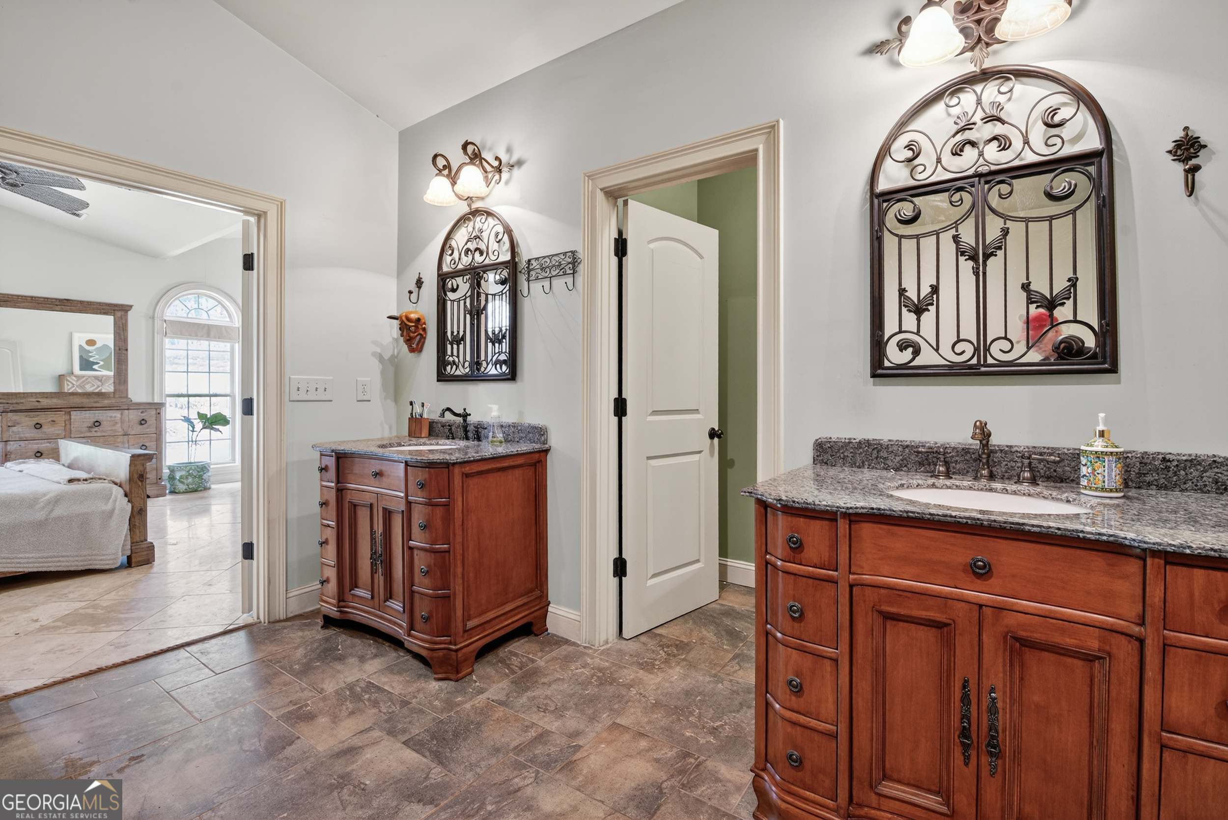 1583 Hickory Flat Road Gillsville, GA 30543 - Photo 27 of 78 a bathroom with a sink a vanity and a mirror