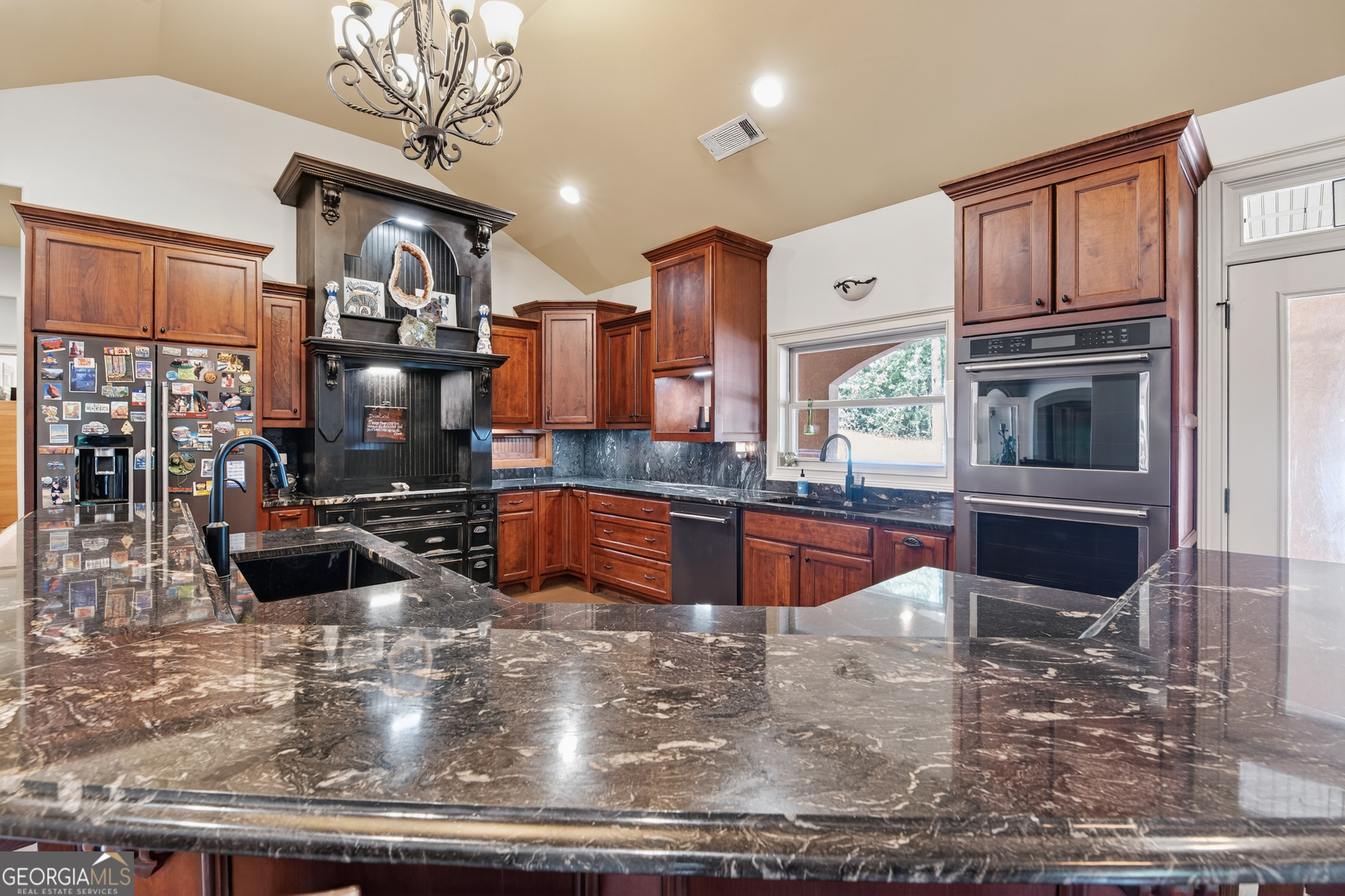 1583 Hickory Flat Road Gillsville, GA 30543 - Photo 42 of 78 a kitchen with stainless steel appliances granite countertop a sink a stove counter space and cabinets