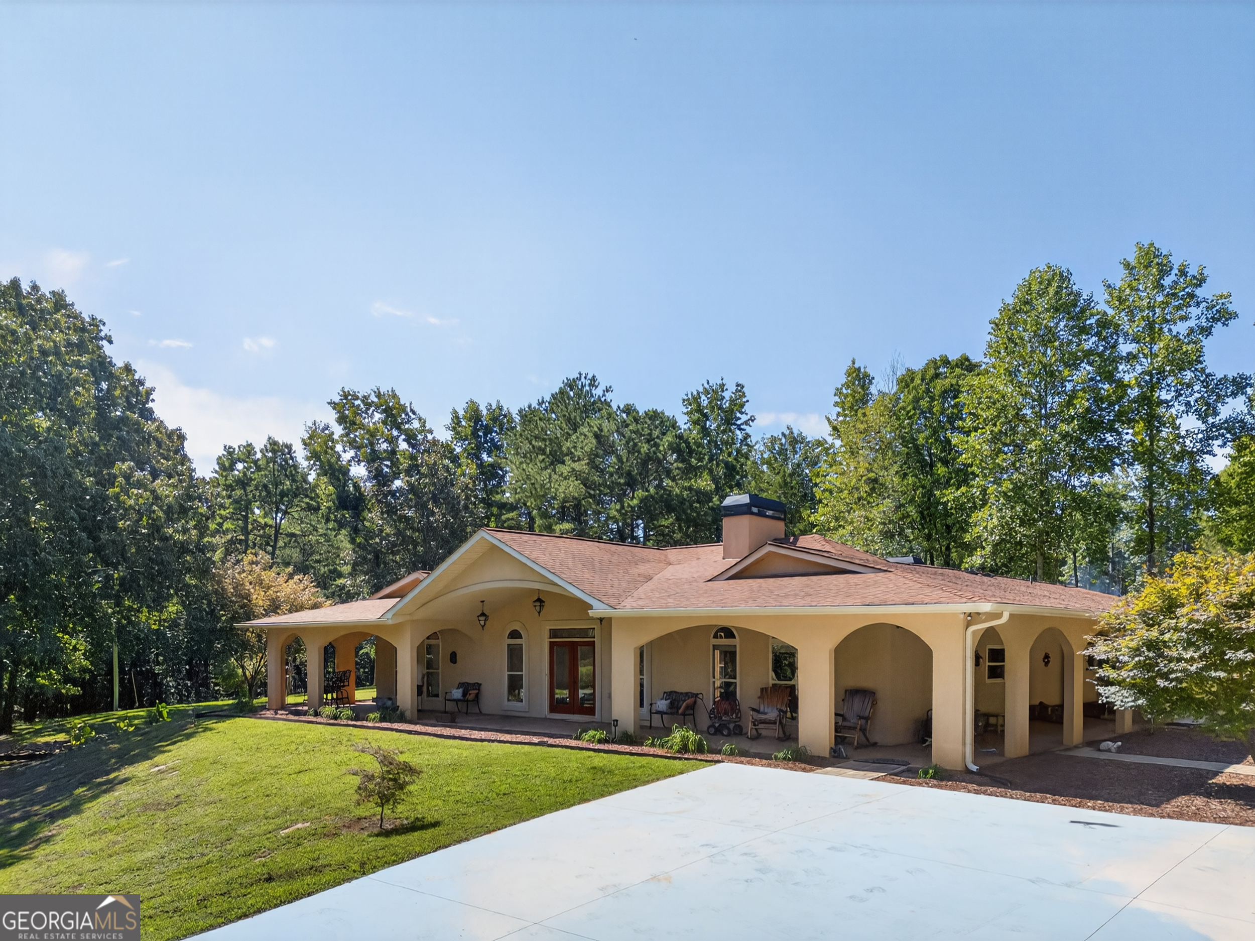 1583 Hickory Flat Road Gillsville, GA 30543 - Photo 64 of 78 a front view of a house with a garden and trees