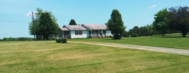 9079 South James River Road Buckingham, VA 23921 - Photo 15 of 16 a front view of a house with a yard