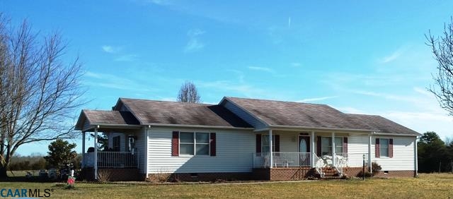 9079 South James River Road Buckingham, VA 23921 - Photo 16 of 16 a front view of a house with a garden