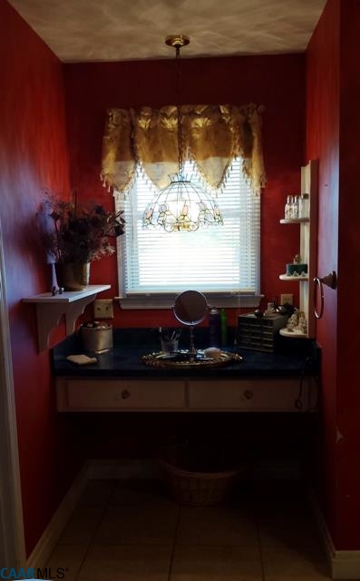9079 South James River Road Buckingham, VA 23921 - Photo 7 of 16 a room with a table and chairs