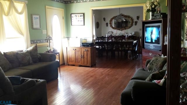 9079 South James River Road Buckingham, VA 23921 - Photo 10 of 16 a living room with furniture and a wooden floor