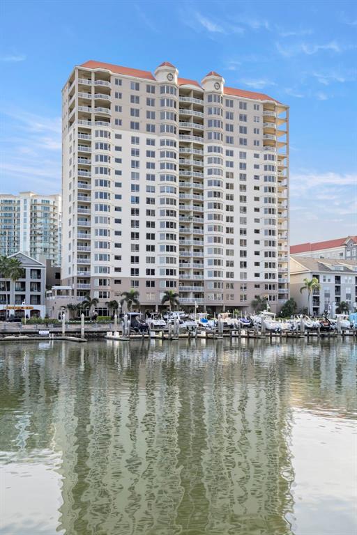 371 Channelside Walk Way, Unit 902 Tampa, FL 33602 - Photo 14 of 50 a tall building sitting next to a lake