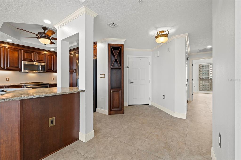 371 Channelside Walk Way, Unit 902 Tampa, FL 33602 - Photo 17 of 50 a view of kitchen with stainless steel appliances granite countertop a refrigerator and a sink
