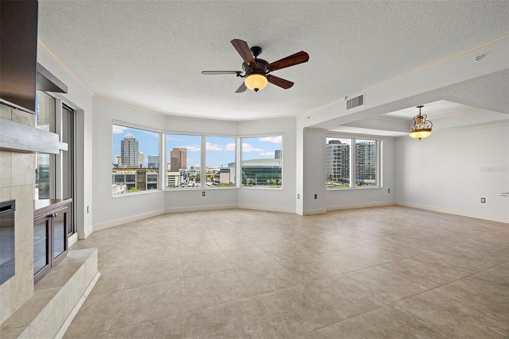 371 Channelside Walk Way, Unit 902 Tampa, FL 33602 - Photo 20 of 50 a view of an empty room with a window and a kitchen view