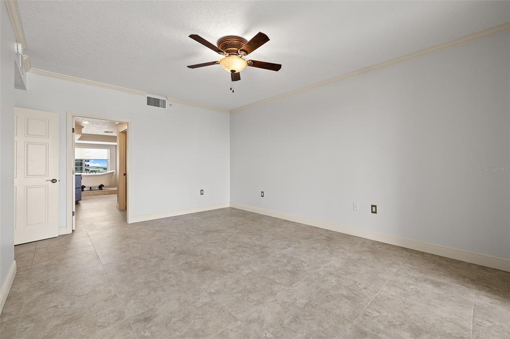 371 Channelside Walk Way, Unit 902 Tampa, FL 33602 - Photo 34 of 50 an empty room with closet and a chandelier fan