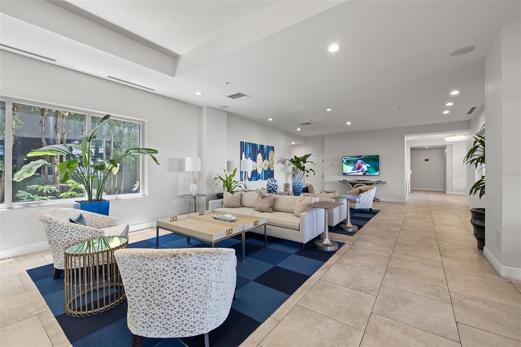 371 Channelside Walk Way, Unit 902 Tampa, FL 33602 - Photo 48 of 50 a living room with furniture and a potted plant