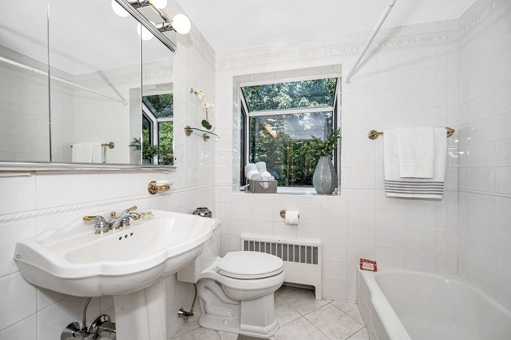 28 Wingate Road Waltham, MA 02451 - Photo 18 of 31 a bathroom with a sink toilet and shower