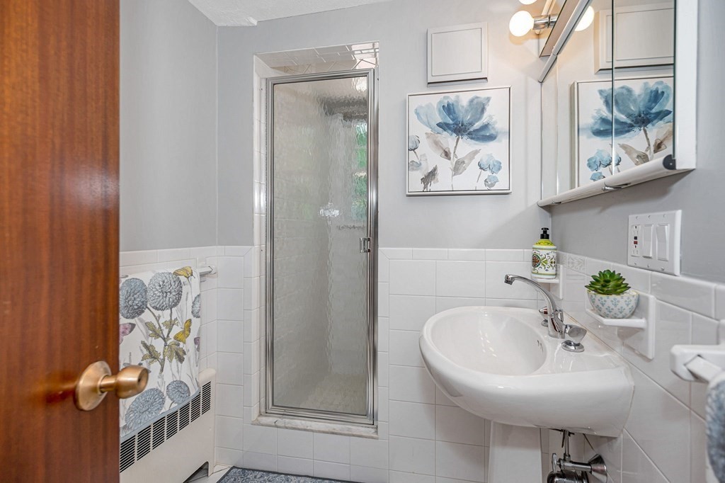 28 Wingate Road Waltham, MA 02451 - Photo 20 of 31 a bathroom with a sink and a mirror
