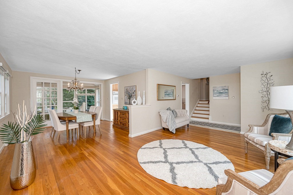 28 Wingate Road Waltham, MA 02451 - Photo 5 of 31 a living room with furniture a dining table and a large window