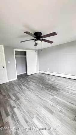 a view of a big room with wooden floor