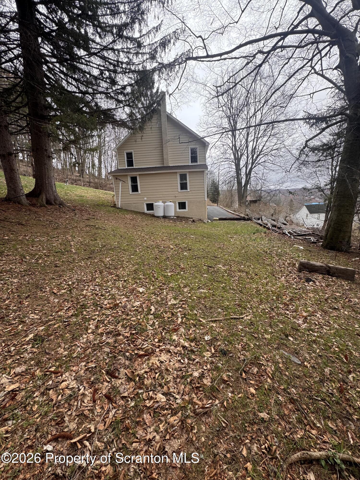 23-25 Shannon Street Simpson, PA 18407 - Photo 16 of 17 a view of a house with a yard