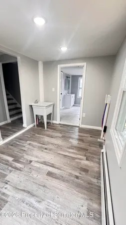 a view of kitchen with furniture and wooden floor
