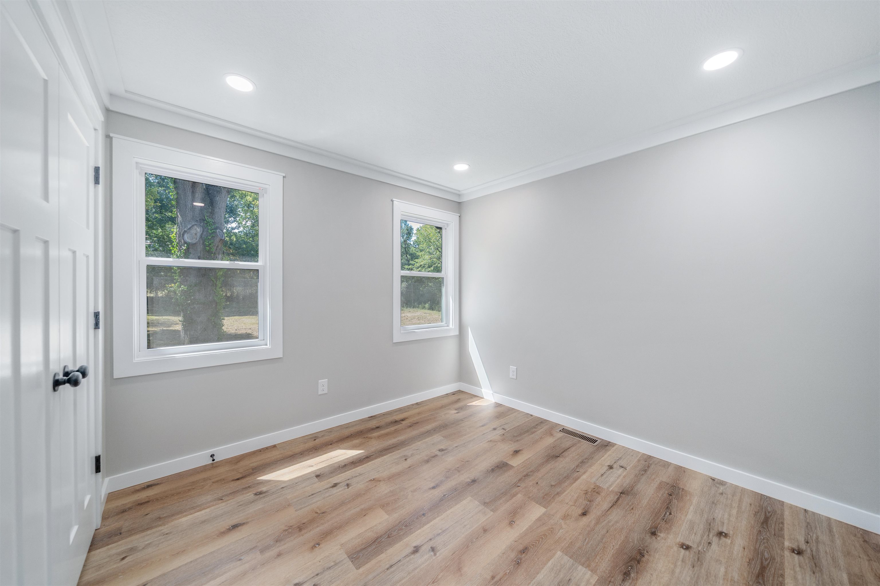 135 West 3rd Street Henderson, TN 38340 - Photo 1 of 31 Unfurnished room with ornamental molding, light wood-style flooring, and recessed lighting