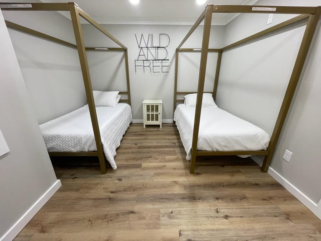 135 West 3rd Street Henderson, TN 38340 - Photo 18 of 31 Bedroom with light wood-style floors and baseboards