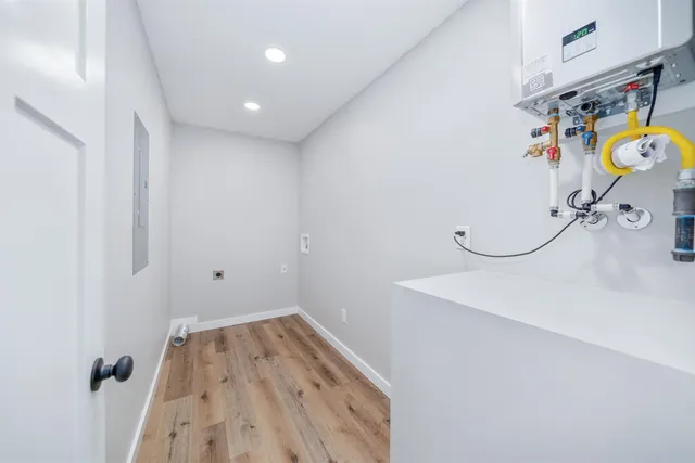 a view of a storage & utility room with a sink
