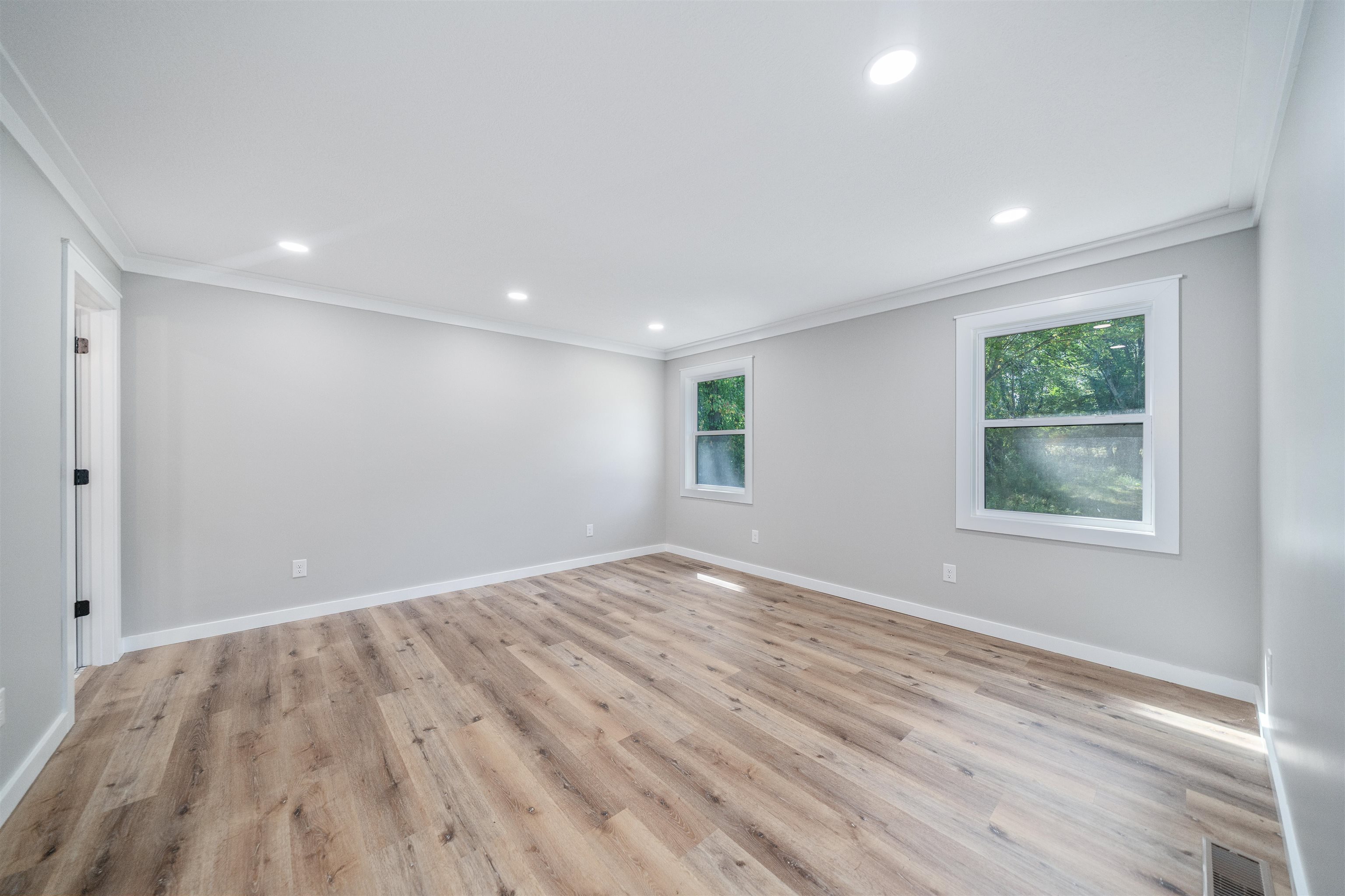 135 West 3rd Street Henderson, TN 38340 - Photo 2 of 31 Unfurnished room featuring ornamental molding, light wood-type flooring, and recessed lighting